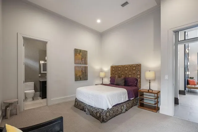 a bed room with a bed and a couch