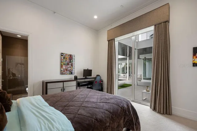 a bedroom with a bed and window