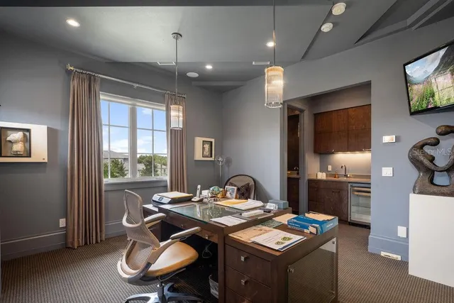 a large swimming pool with outdoor seating