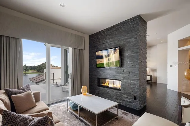 an aerial view of lake and residential houses with outdoor space