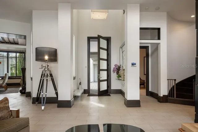 a living room with furniture and dining room