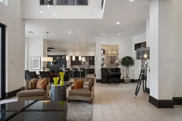 a bathroom with a granite countertop sink toilet mirror and shower