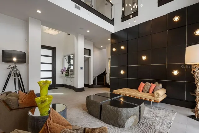 a view of a dining room with furniture and chandelier