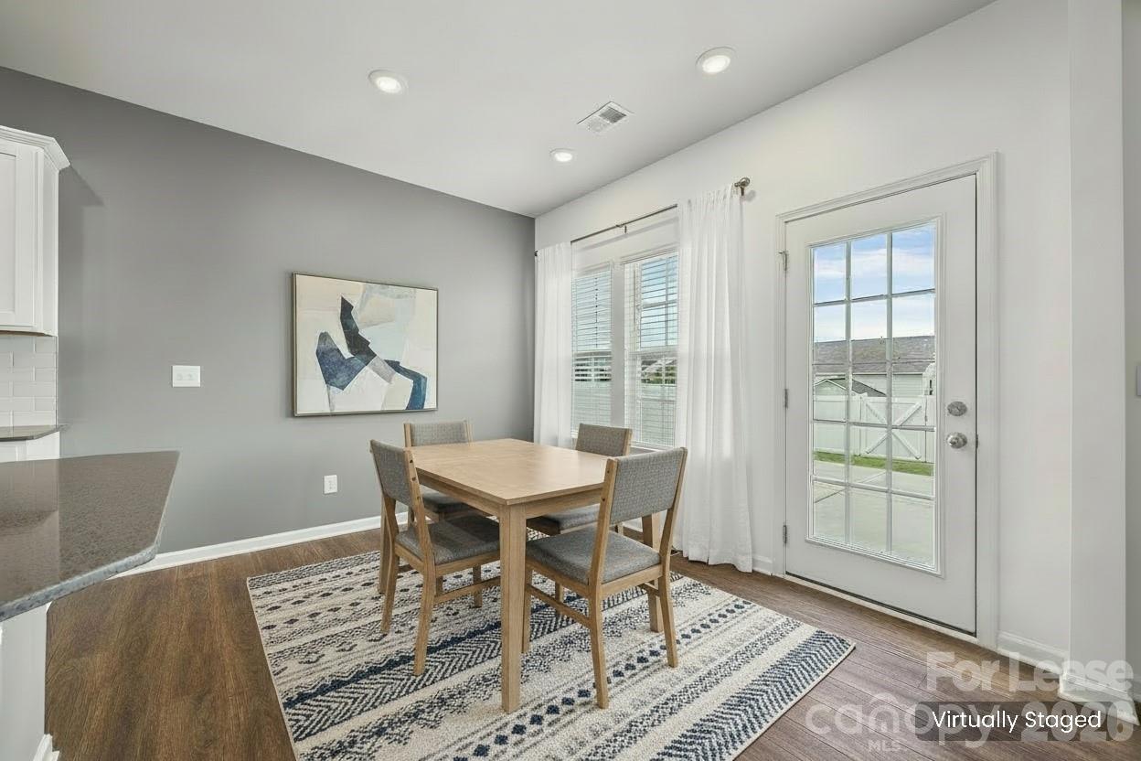 5775 Soft Shell Drive Lancaster, SC 29720 - Photo 11 of 40 a view of a dining room with furniture and wooden floor