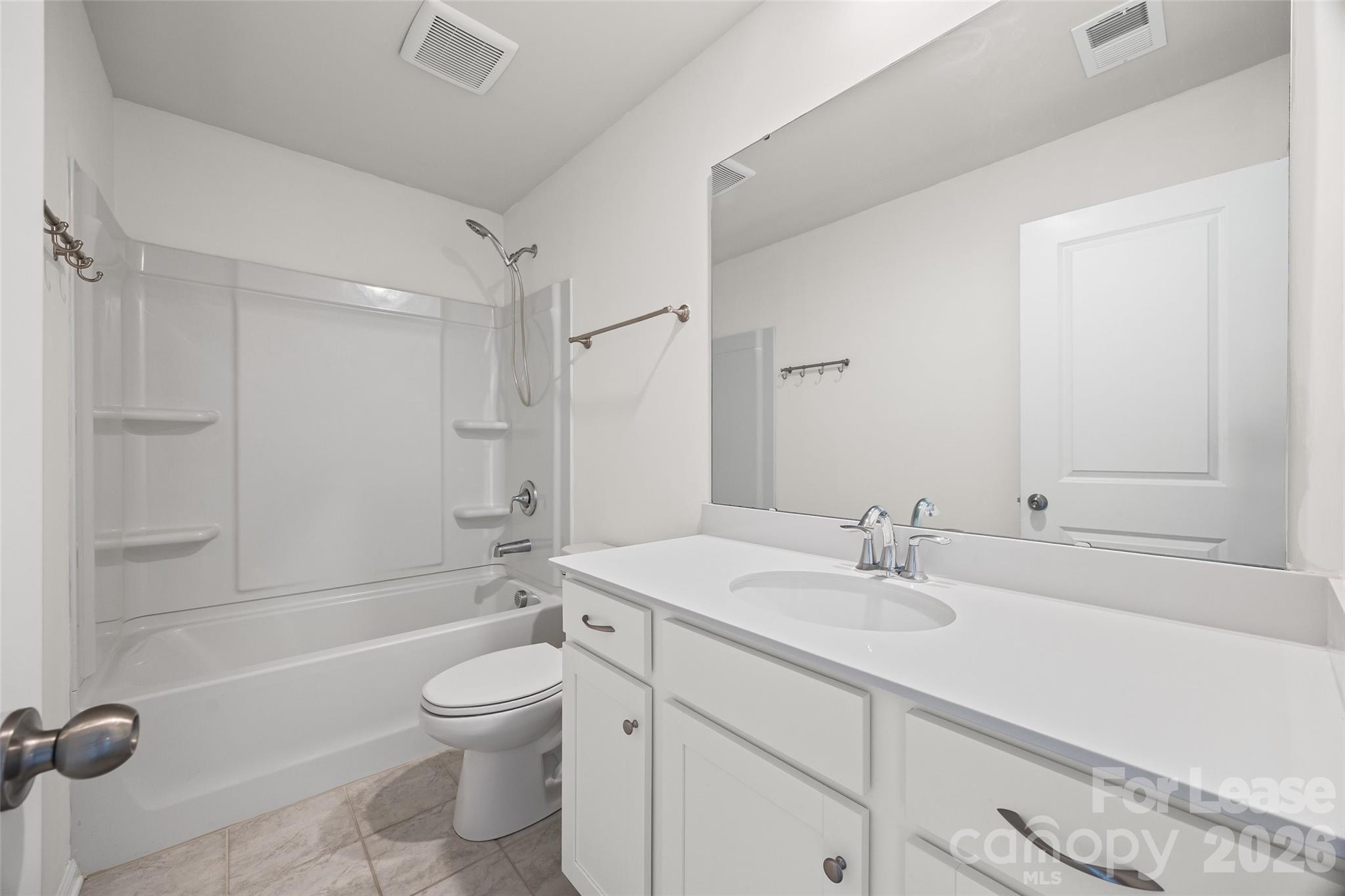 5775 Soft Shell Drive Lancaster, SC 29720 - Photo 27 of 40 a bathroom with a sink a toilet and shower