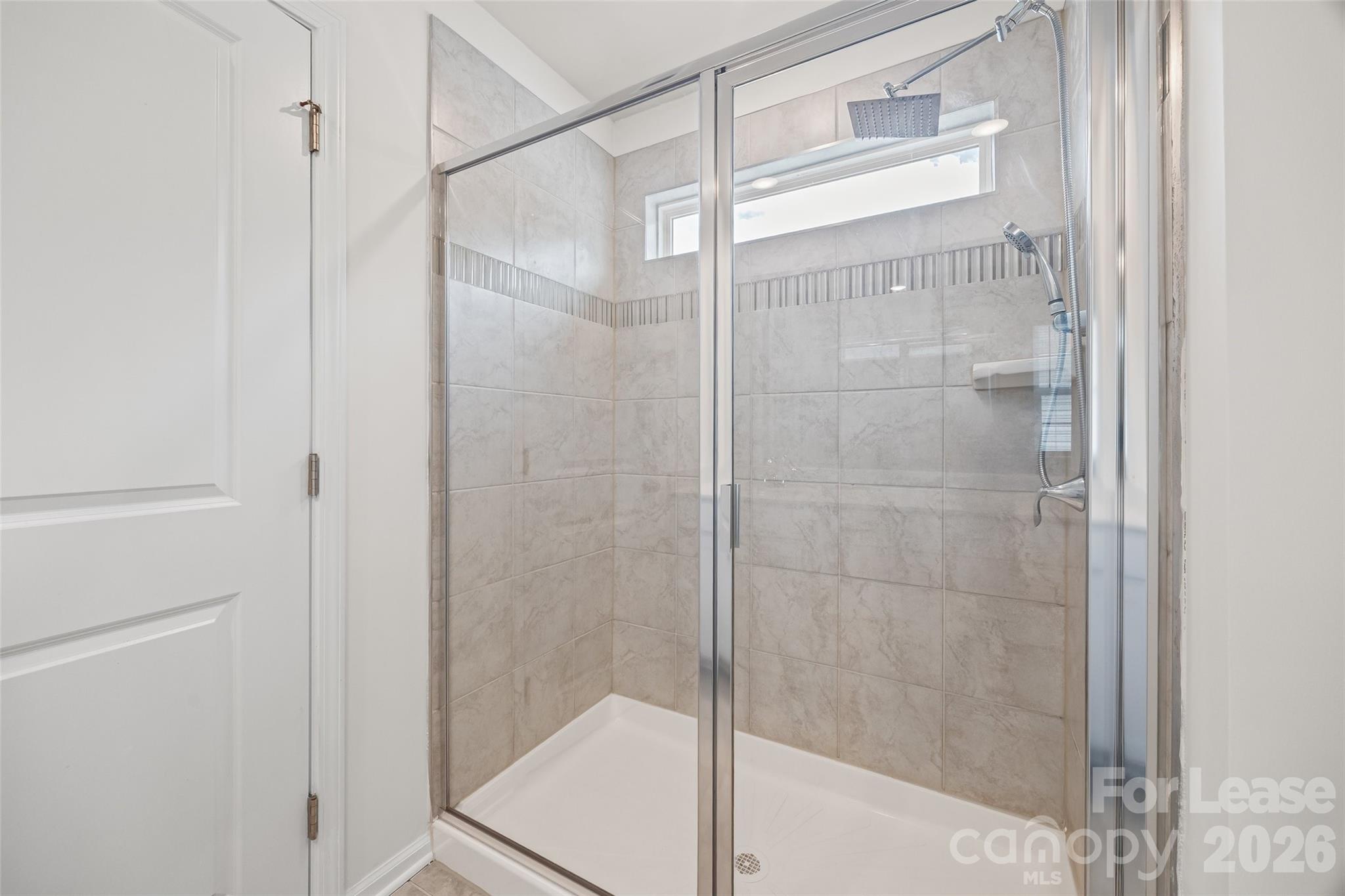 5775 Soft Shell Drive Lancaster, SC 29720 - Photo 32 of 40 a bathroom with a glass door shower