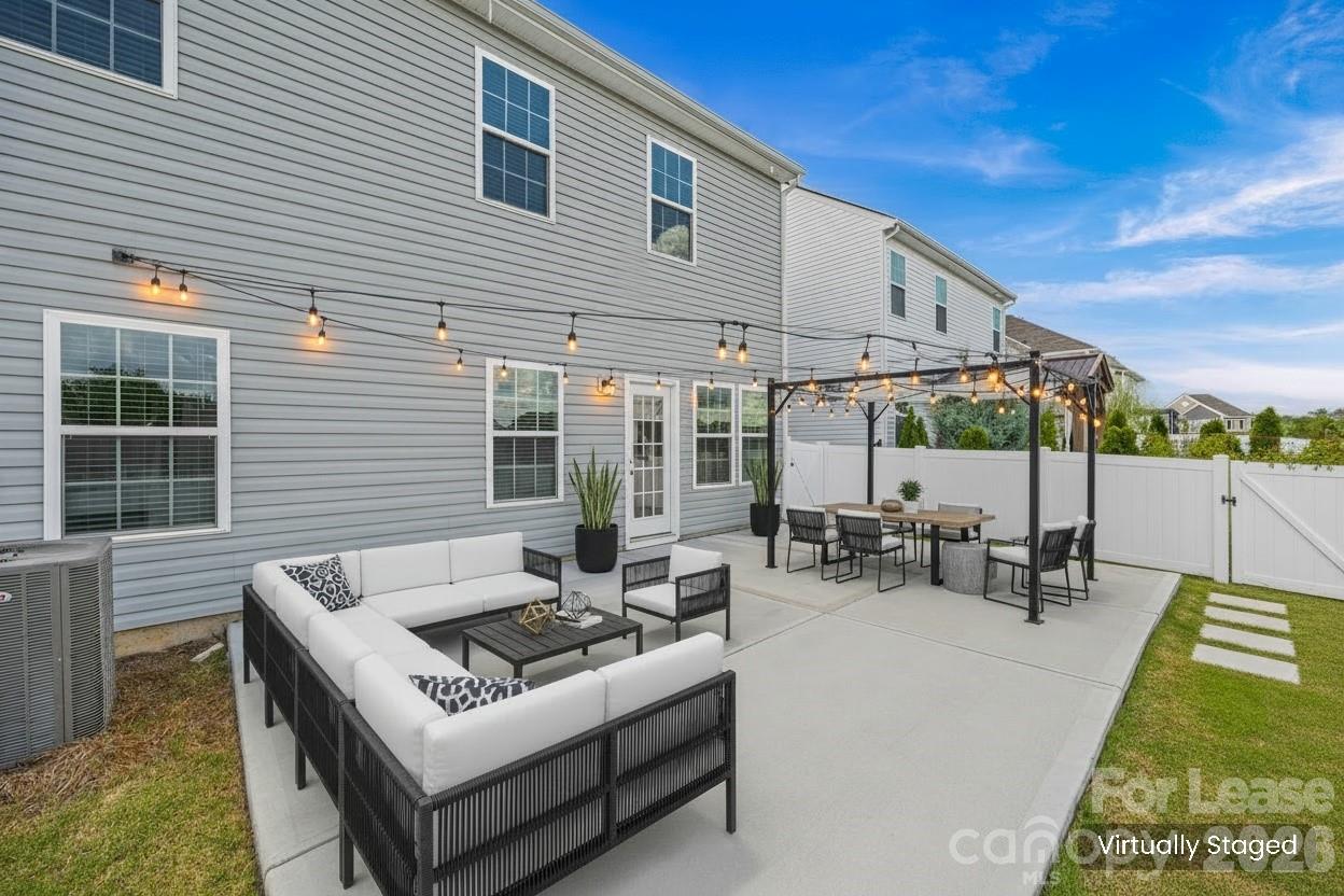 5775 Soft Shell Drive Lancaster, SC 29720 - Photo 36 of 40 a view of a patio with couches table and chairs and potted plants
