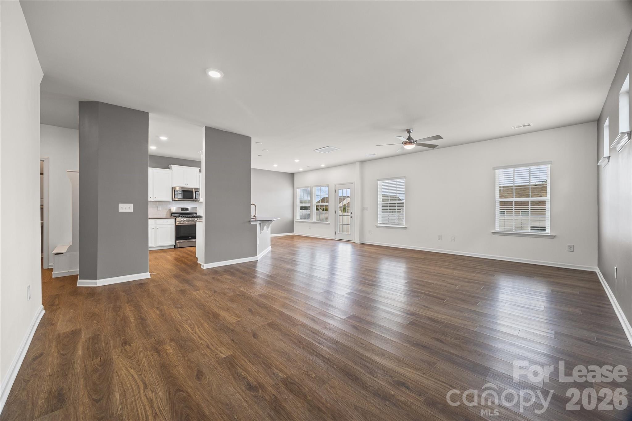 5775 Soft Shell Drive Lancaster, SC 29720 - Photo 6 of 40 a view of empty room with kitchen and window