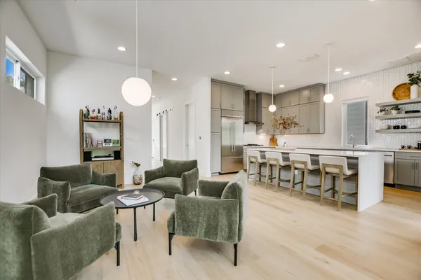 a kitchen with a table and chairs in it