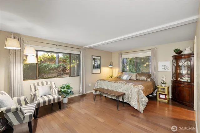 a bedroom with a bed and a couch