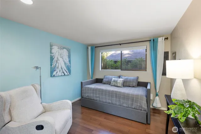 a bedroom with a bed and a couch