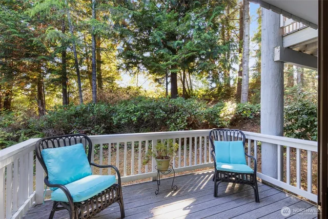 a view of a chair and table on the deck