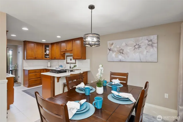 a large kitchen with a table and chairs