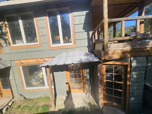 a front view of a house with large windows