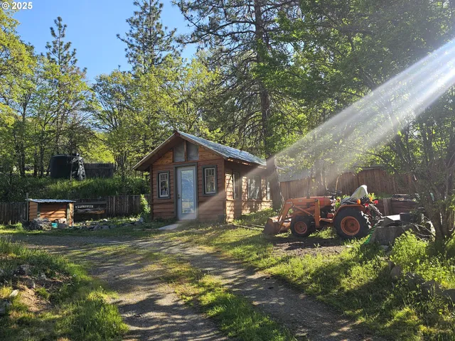 a backyard of a house with lots of green space