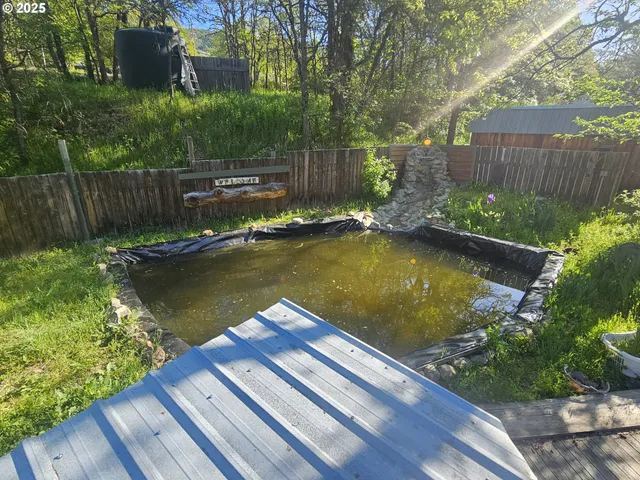 a view of a lake with wooden floor
