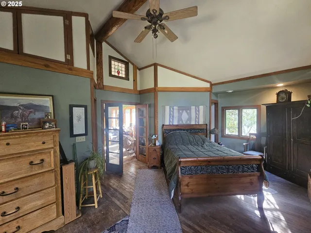 a living room with furniture and a painting on the wall