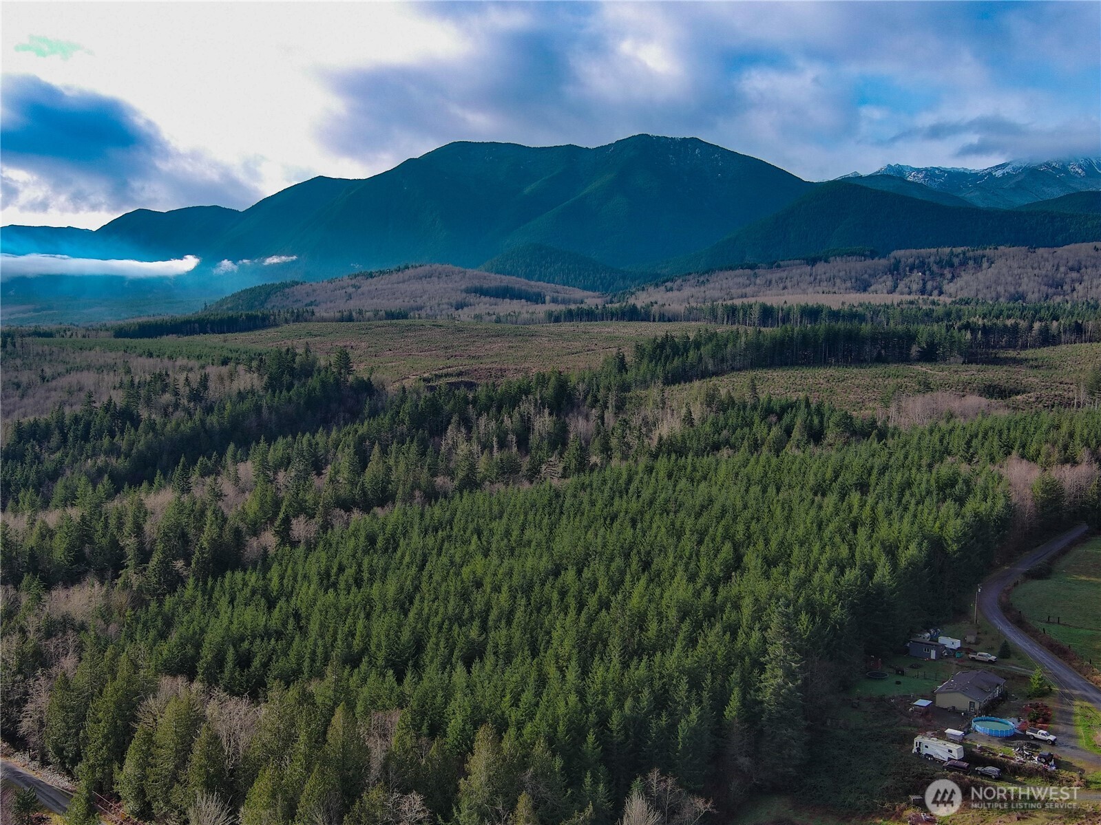 1-xxx Snow Creek Road Quilcene, WA 98376 - Photo 10 of 11 a view of a lake and green valley