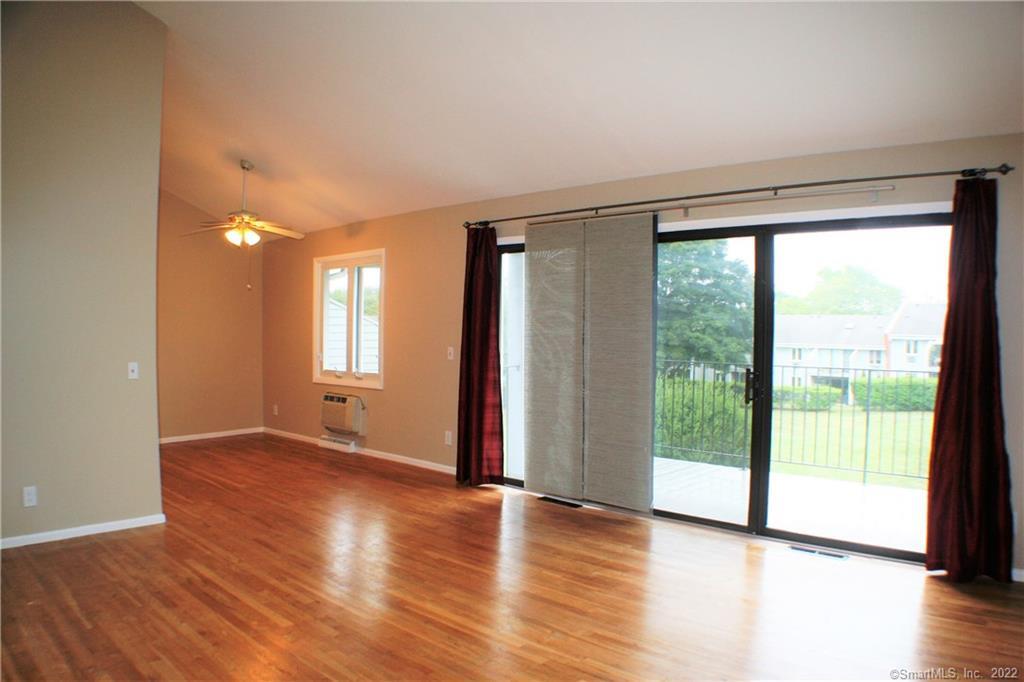 129 Florence Road, Unit 2B Branford, CT 06405 - Photo 1 of 1 a view of an empty room with wooden floor and a window