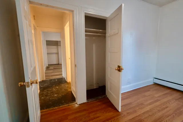 a view of a bathroom with wooden floor
