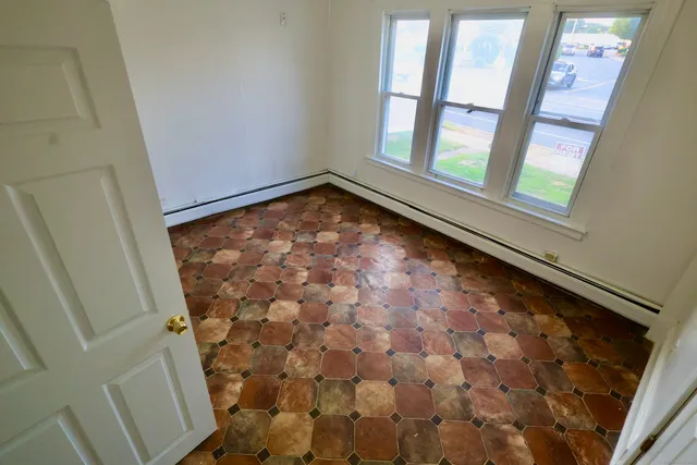 a view of empty room with windows