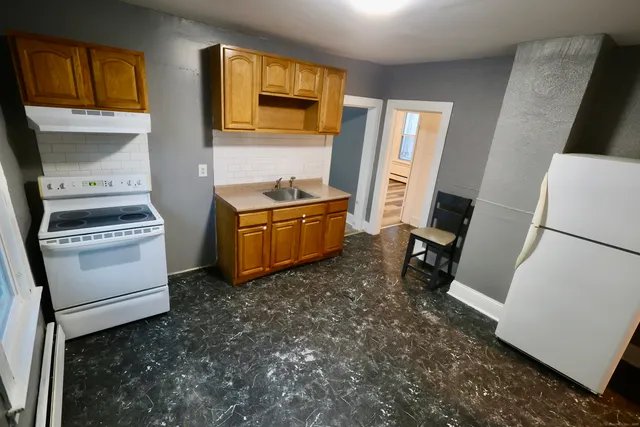 a room with furniture a washer and dryer