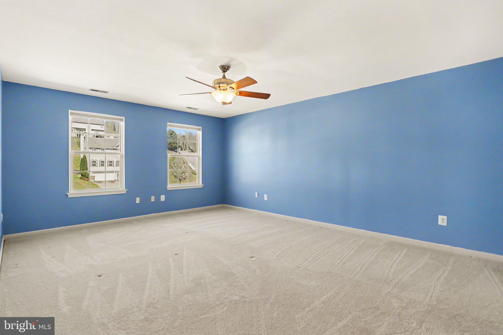 503 Windy Way New Cumberland, PA 17070 - Photo 16 of 29 an empty room with windows and ceiling fan