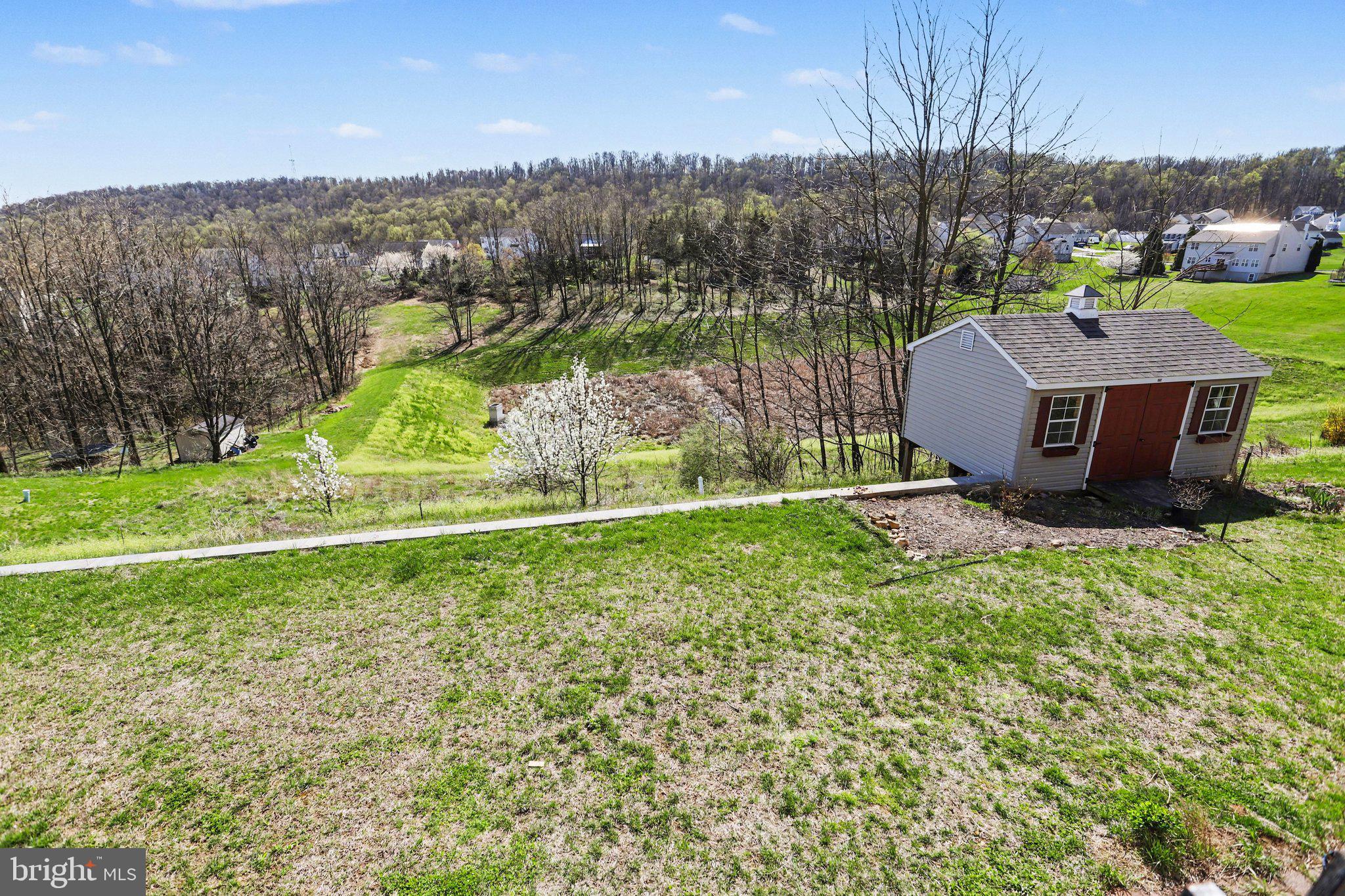 503 Windy Way New Cumberland, PA 17070 - Photo 21 of 29 a view of a garden with a building in the background