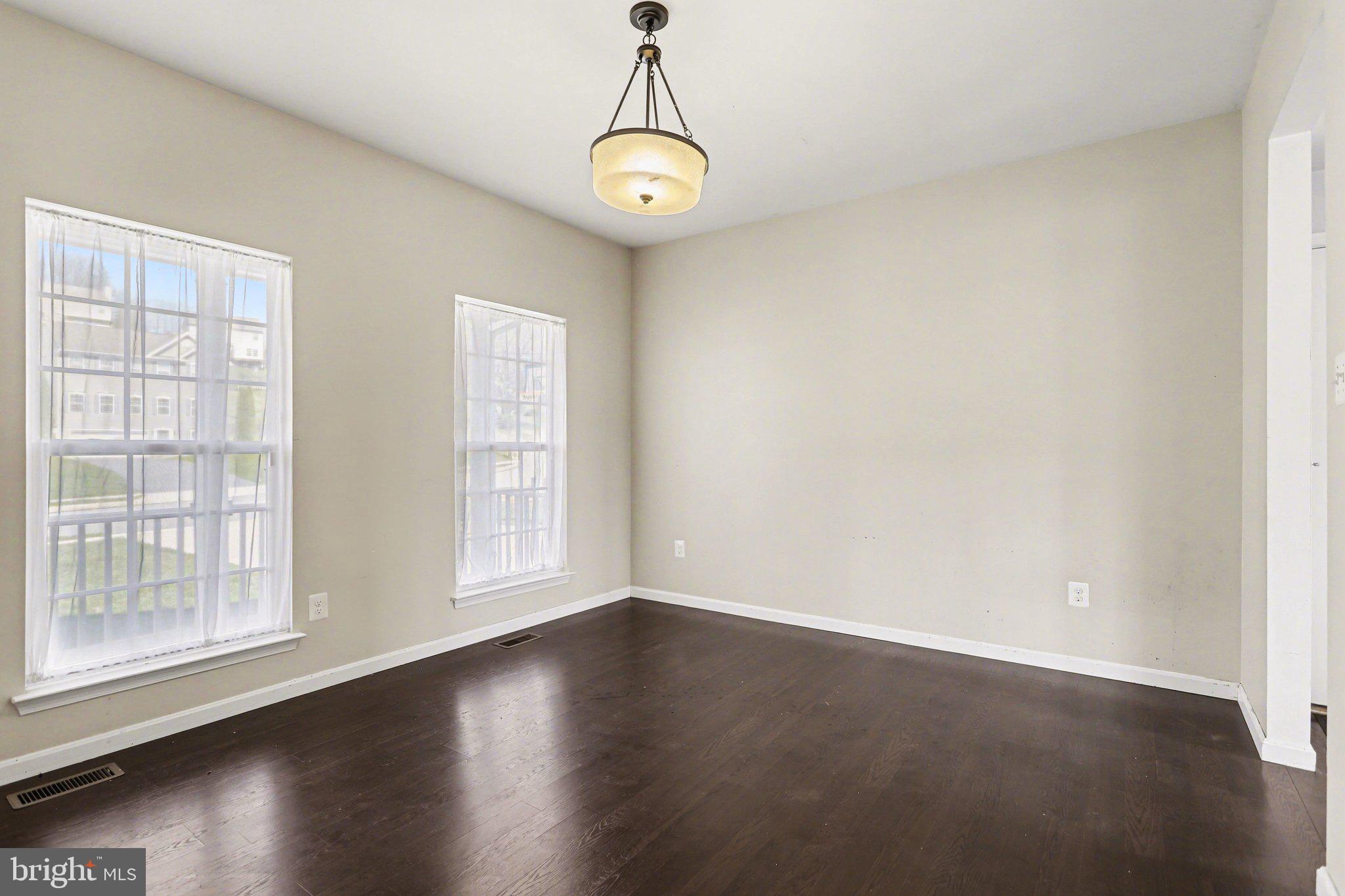 503 Windy Way New Cumberland, PA 17070 - Photo 5 of 29 an empty room with wooden floor and windows