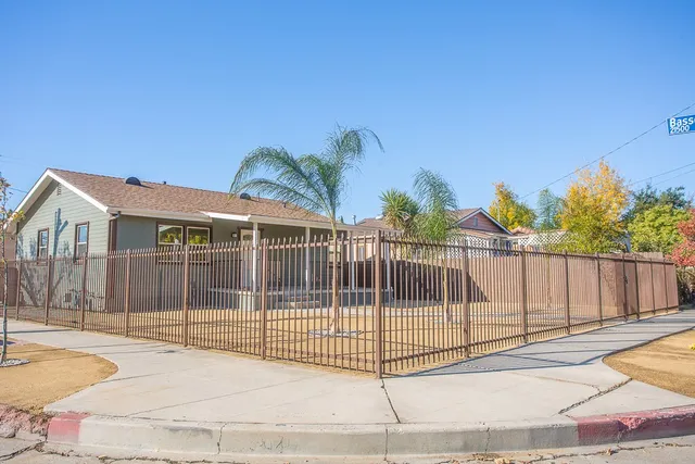 a view of a wrought iron fences in front of house
