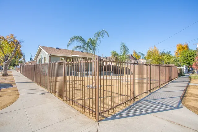 a view of a wrought iron fences in front of house