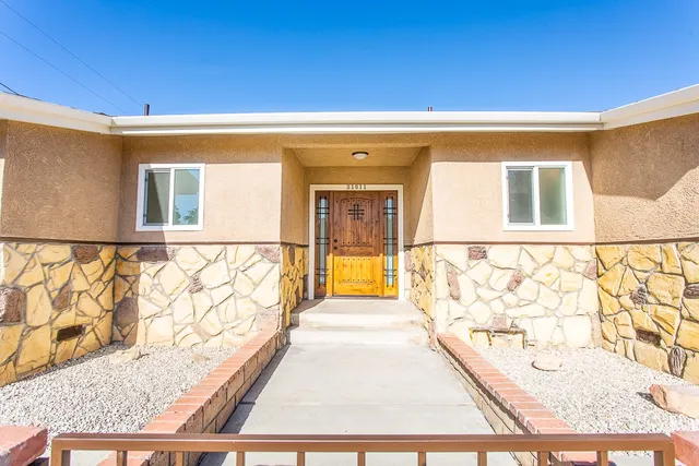 a view of a door and wooden floor