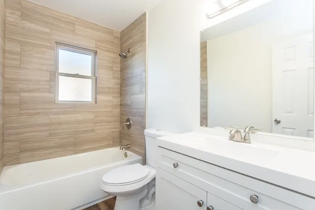 a bathroom with a sink a toilet and a bathtub