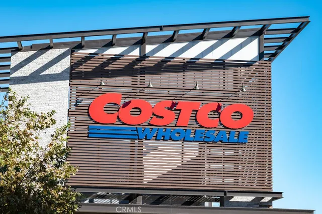 a street sign on a wall next to a building