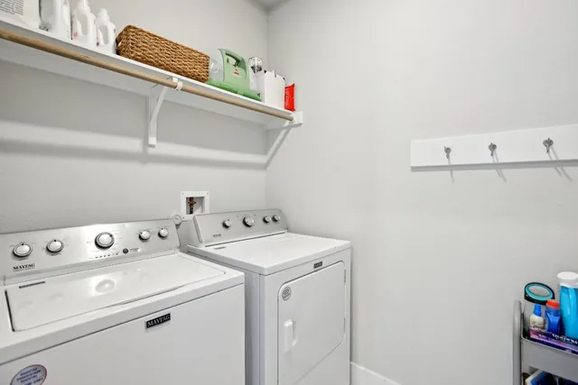 a utility room with dryer and washer