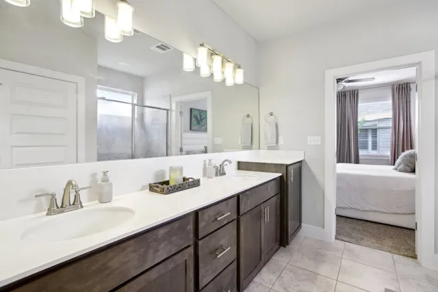 a bathroom with a sink vanity and a mirror