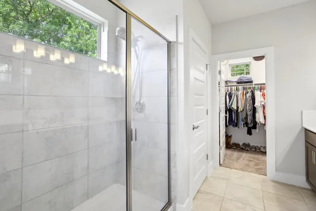 a bathroom with a bathtub and shower