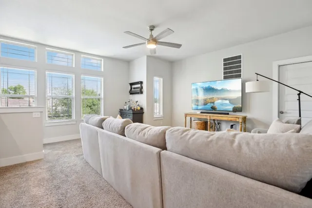 a living room with furniture and a large window