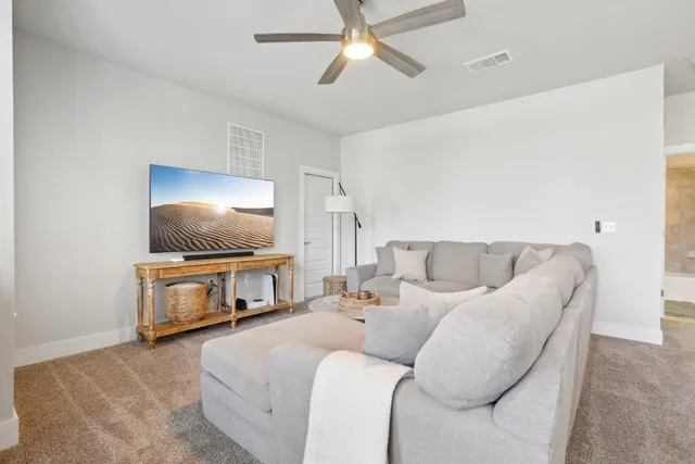 a living room with a couch and a flat screen tv