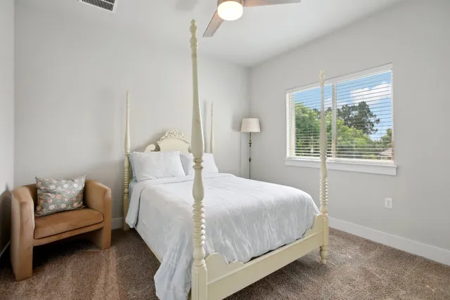 a bedroom with a bed and a couch