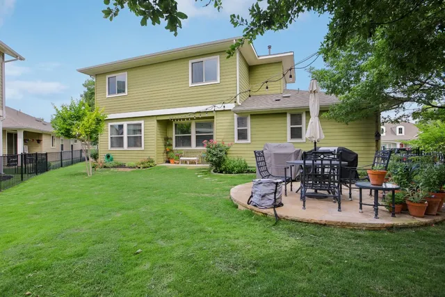 a view of a backyard with large trees