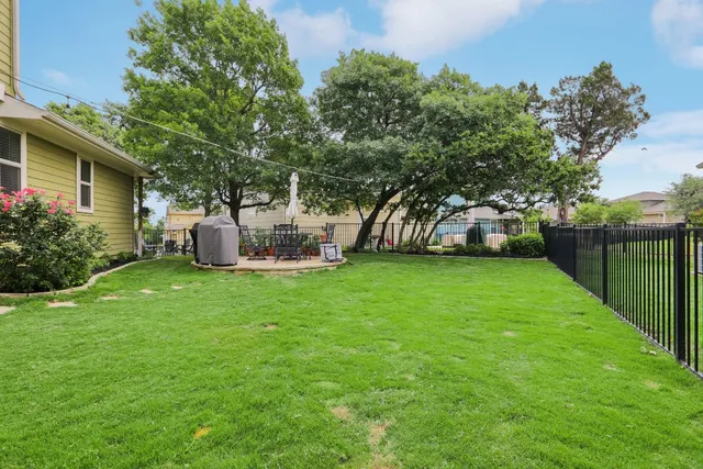 a backyard of a house with outdoor seating yard and outdoor seating