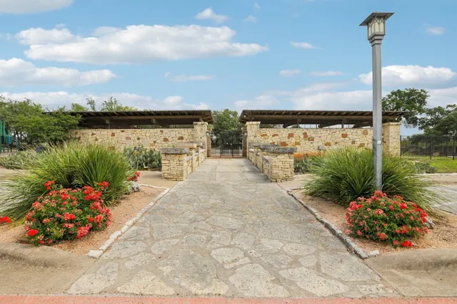 a view of a swimming pool with a table and chairs