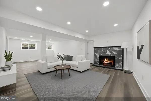a dining room with furniture and wooden floor