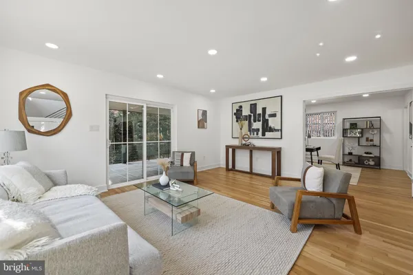 a view of a porch with a floor to ceiling window and wooden fence