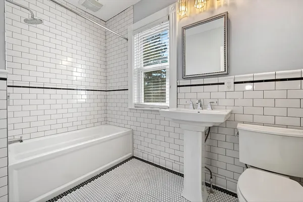 a bathroom with a sink and a bathtub