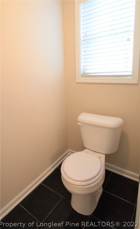 4308 Rocinta Court Hope Mills, NC 28348 - Photo 14 of 23 a white toilet sitting next to a window