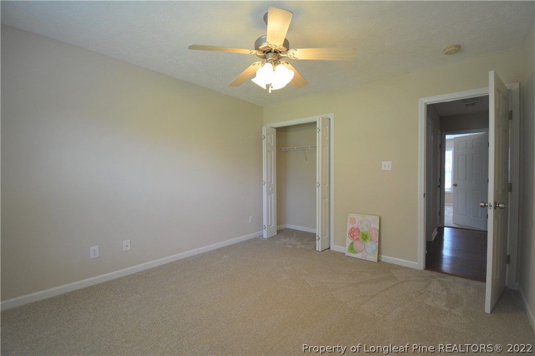 4308 Rocinta Court Hope Mills, NC 28348 - Photo 17 of 23 an empty room with chandelier fan