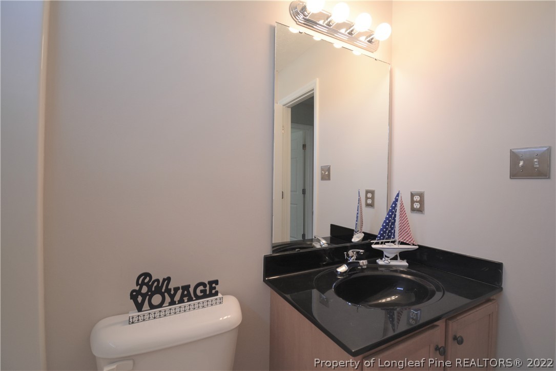 4308 Rocinta Court Hope Mills, NC 28348 - Photo 18 of 23 a bathroom with a sink and a mirror