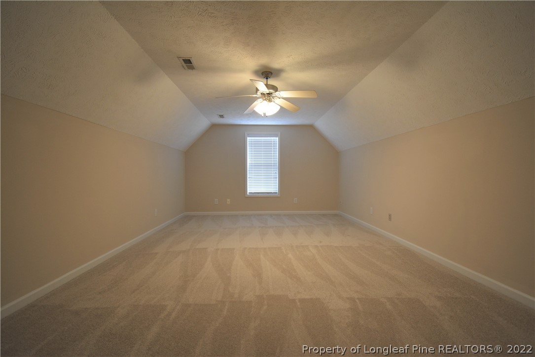 4308 Rocinta Court Hope Mills, NC 28348 - Photo 21 of 23 an empty room with a window and a ceiling fan